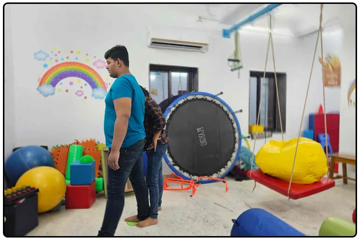 Mentor guiding a learner through a hands-on vocational task